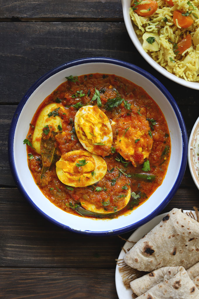 aerial shot of Punjabi anda curry served on a white platter