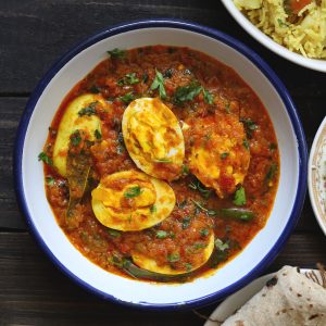 aerial shot of egg curry in a white plate