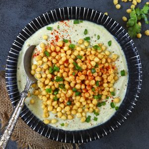 aerial shot of boondi raita in a black ceramic bowl