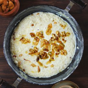 aerial shot of rice kheer in a black kadhai