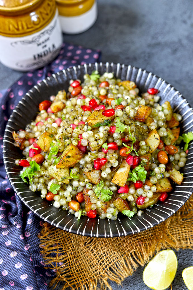 side shot of sabudana khichdi in a black ceramic platter