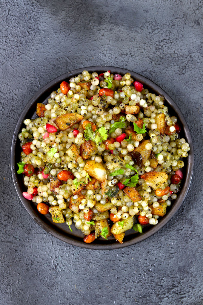 aerial shot of sago upma on a black ceramic platter