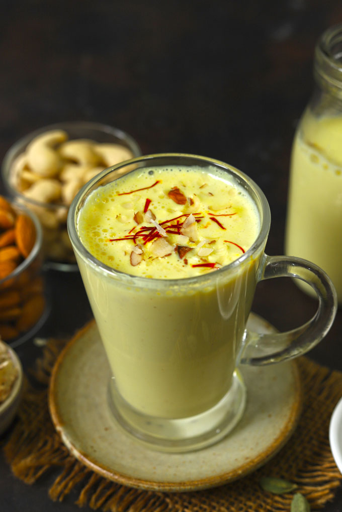 side close up shot of badam milk in a glass mug