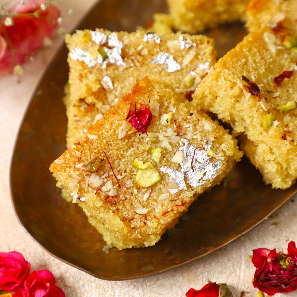 side close up shot of semolina cake stacked on a copper platter - 71