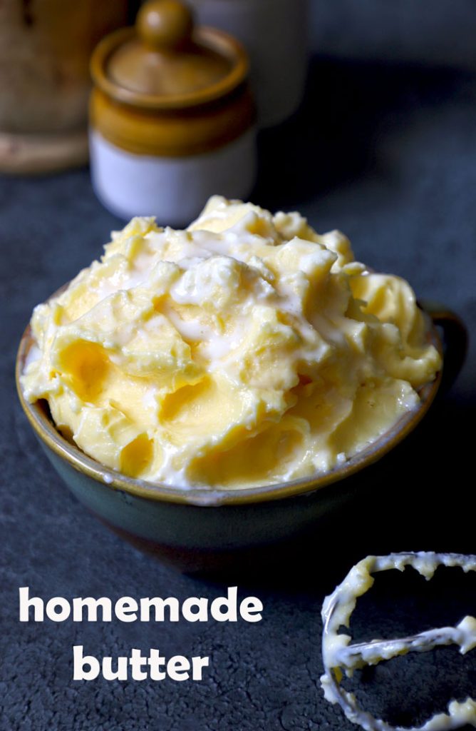 side close up shot of homemade butter in a bowl with a spoon