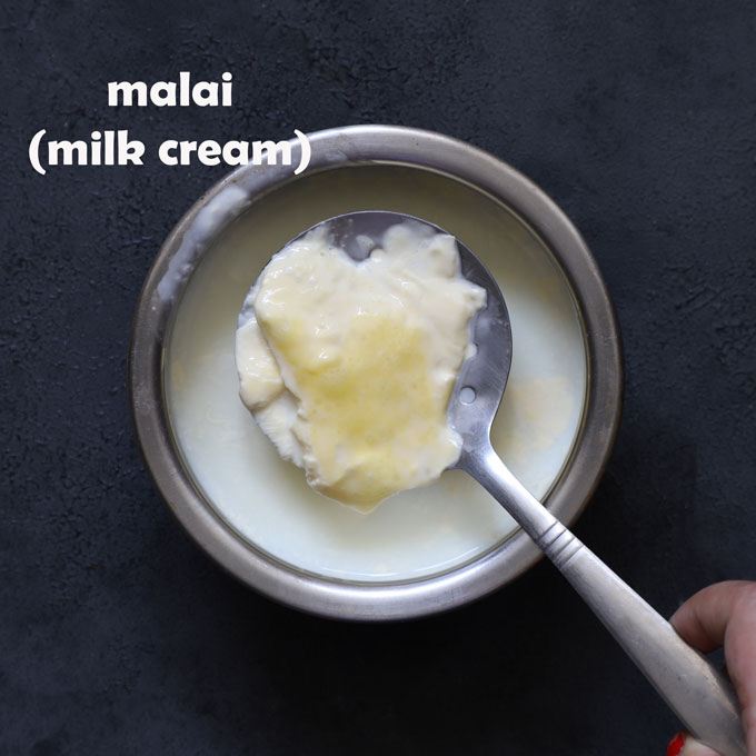 aerial shot of malai in a slotted spoon