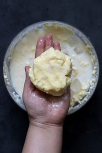 aerial shot of homemade butter ball in a hand