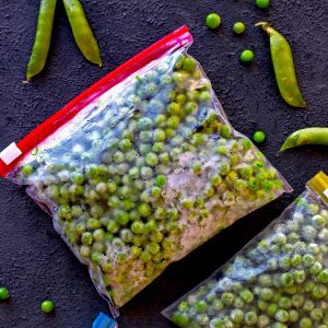 aerial shot of frozen green peas in a ziplock bag