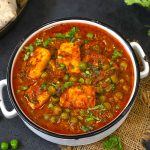 aerial shot of matar paneer in a white bowl