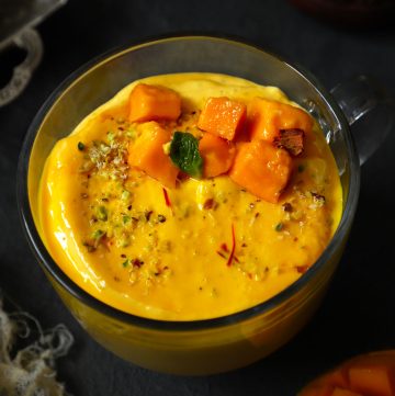 side shot of mango shrikhand in a glass mug