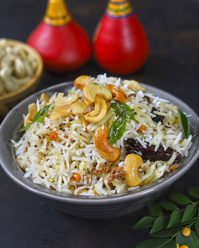 side shot of coconut rice in a black ceramic bowl