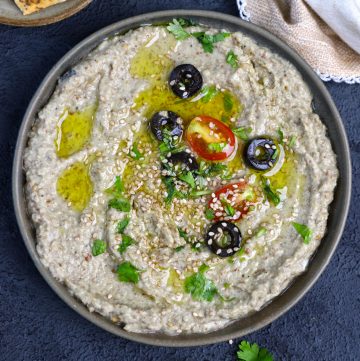 aerial shot of baba ganoush in a black ceramic bowl