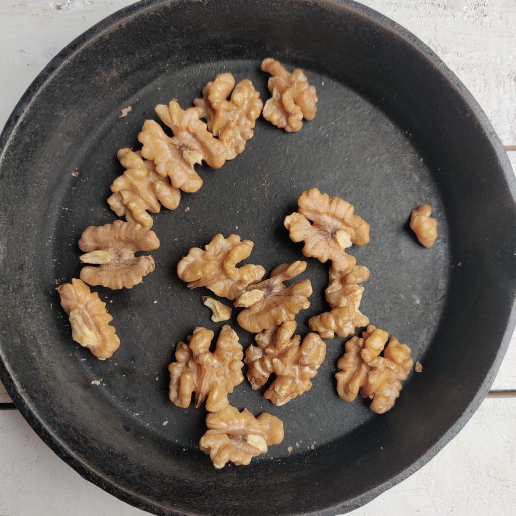 toasting walnuts in a cast iron pan