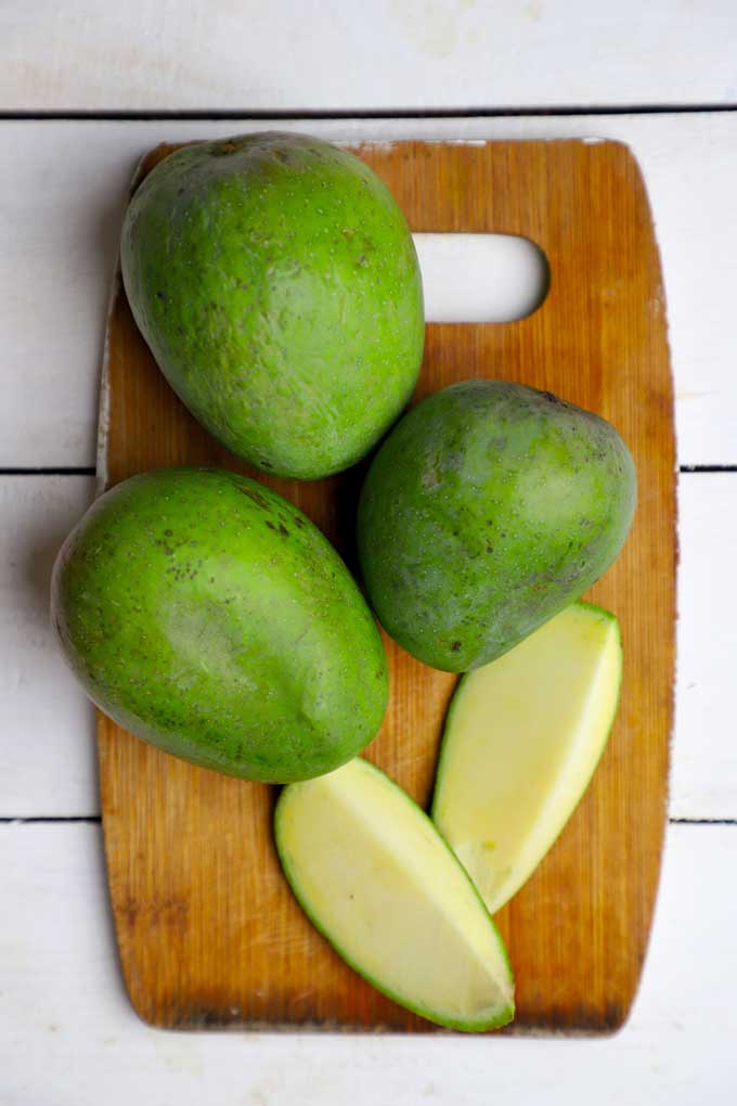 aerial shot of Indian Raw Mango on a wooden board