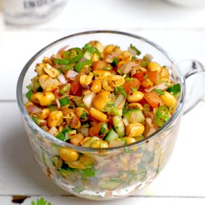 side shot of peanut chaat in a glass mug