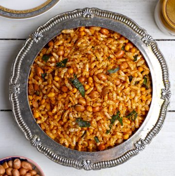 aerial shot of spicy murmura namkeen on a silver bowl