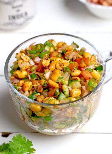side shot of peanut chaat in a glass mug