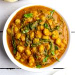 aerial shot of chana saag in a white ceramic bowl