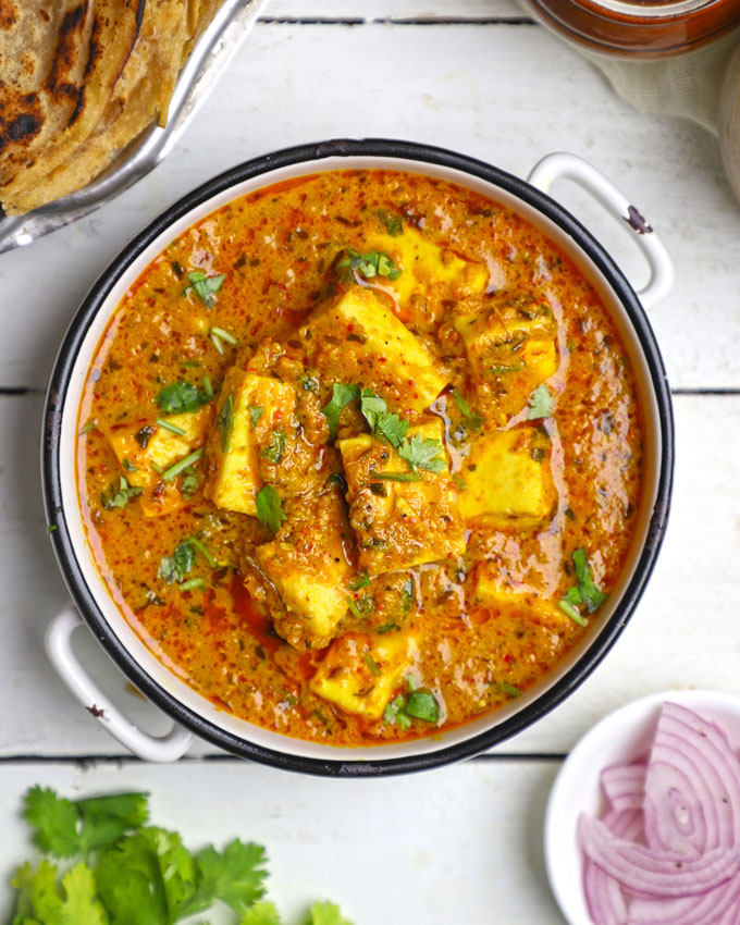 aerial shot of paneer curry in a white ceramic bowl