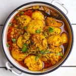 aerial shot of potato curry in a white ceramic bowl