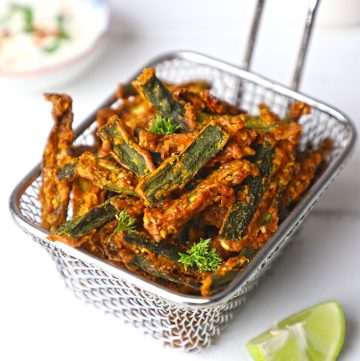 side shot of kurkuri bhindi on a wire basket