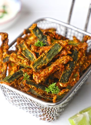 side shot of kurkuri bhindi on a wire basket