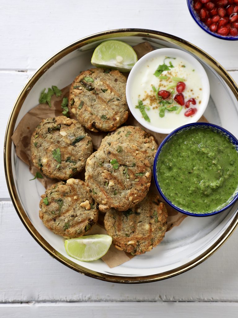 aerial shot of farali aloo tikki on a platter with chutney