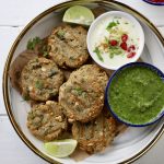 aerial shot of farali aloo tikki on a platter with chutney