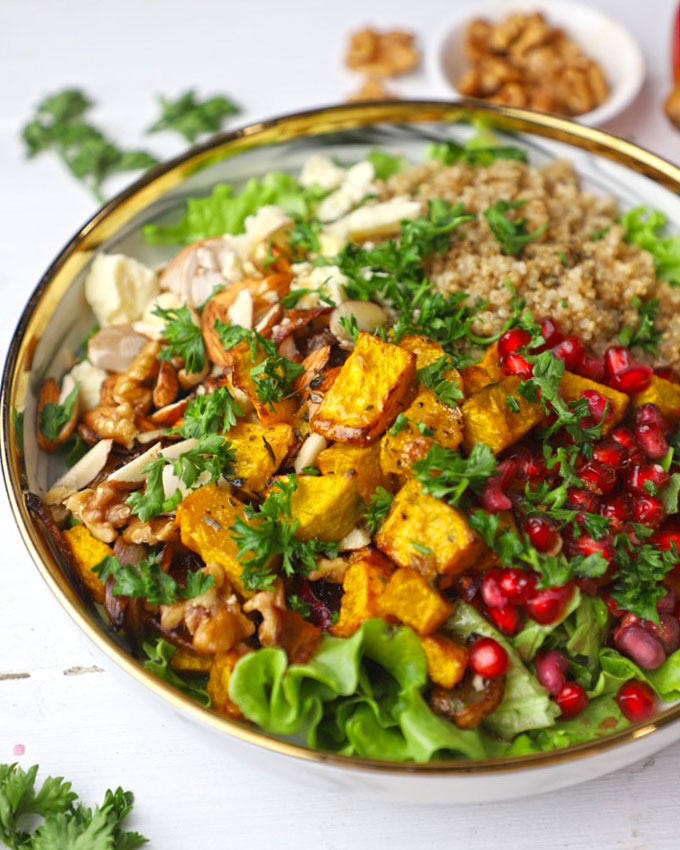 side shot of pumpkin salad on a white ceramic platter