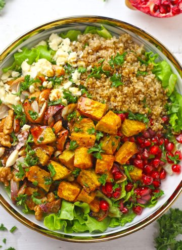 aerial shot of pumpkin salad on a white ceramic platter