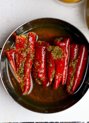 aerial shot of lal mirch ka achar in a stainless steel bowl