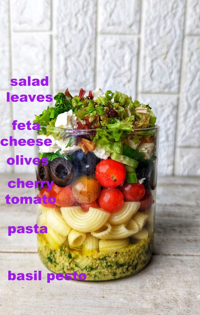 side shot of pesto pasta salad jar