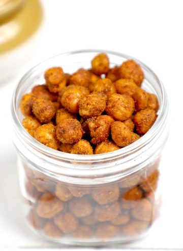 side shot of air fryer crispy chickpeas in a glass jar