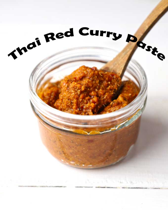 side shot of homemade Thai red curry paste in a glass jar