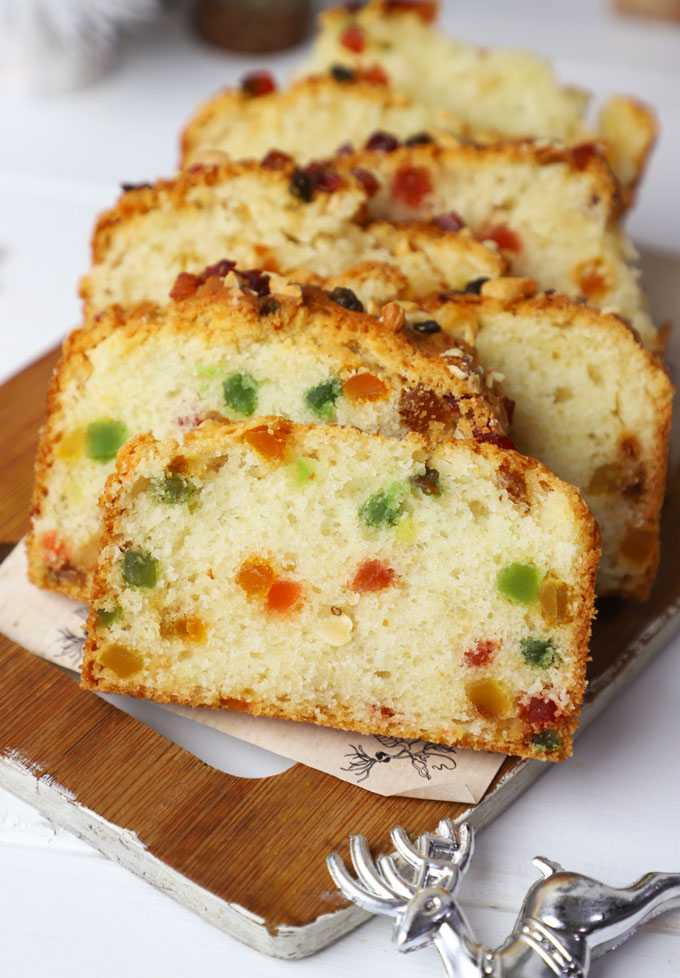 side shot of eggless tutti frutti cake stacked on a platter