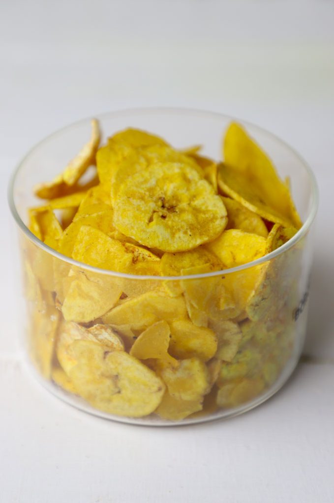 side shot of banana chips in a glass jar