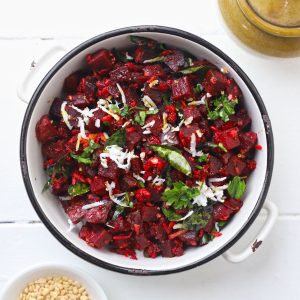 aerial shot of beetroot poriyal in a white ceramic bowl