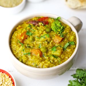 side shot of millet khichdi in a mug