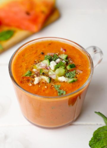 side shot of watermelon gazpacho in a glass mug