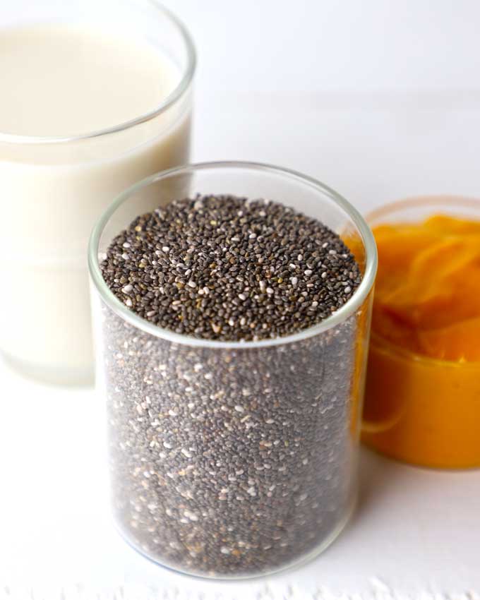 side shot of black chia seeds in a glass jar
