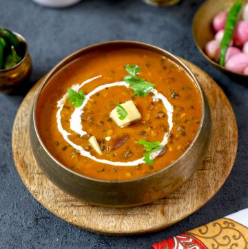 side top shot of dal makhani in a traditional Indian bowl