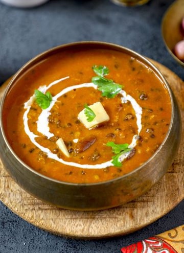 side top shot of dal makhani in a traditional Indian bowl