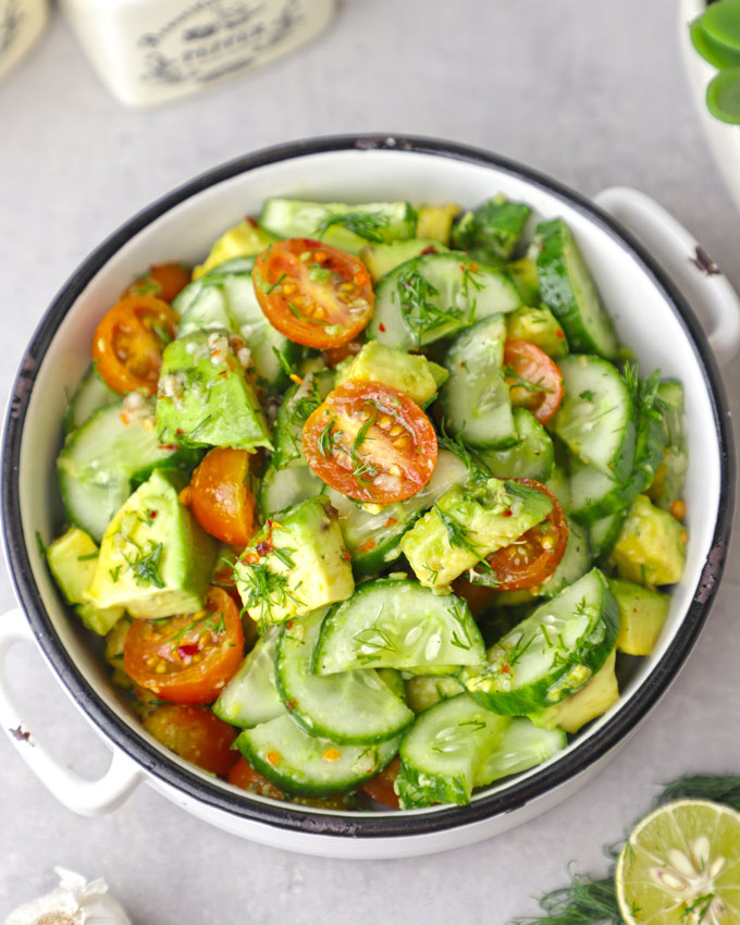 aerial shot of avocado salad in a white ceramic bowl