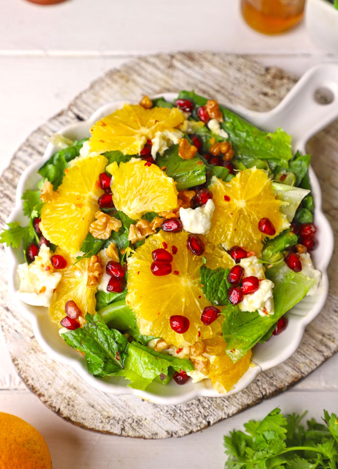 aerial shot of orange salad served on a white platter