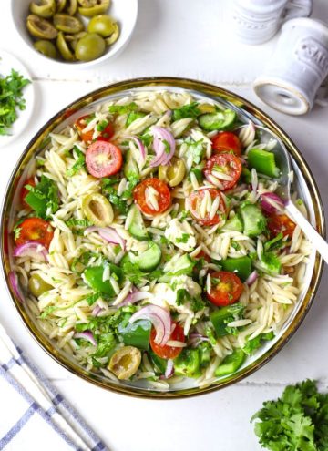 aerial shot of Greek orzo pasta salad in a white bowl