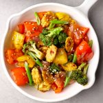 aerial shot of vegetable stir fry in a white pan