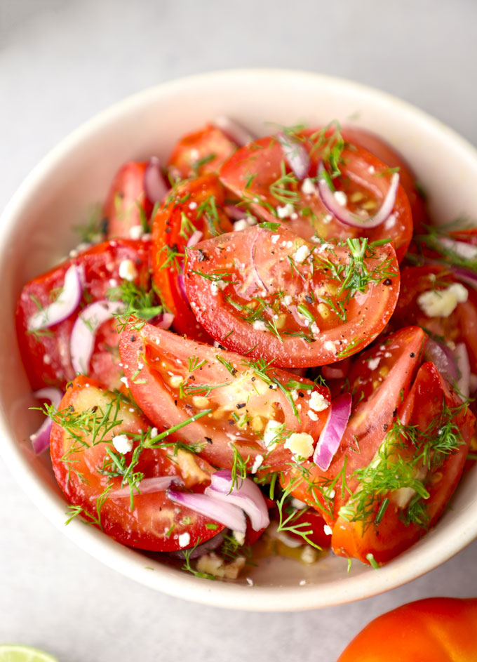 side close up shot of tomato salad in a bowl