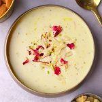 aerial shot of badam kheer in a brass bowl