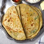 aerial shot of gobi paratha served on a platter