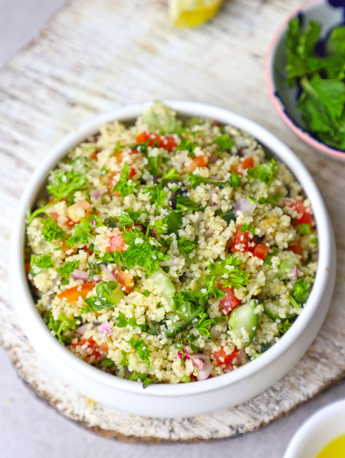 aerial shot of couscous salad in a white ceramic bowl